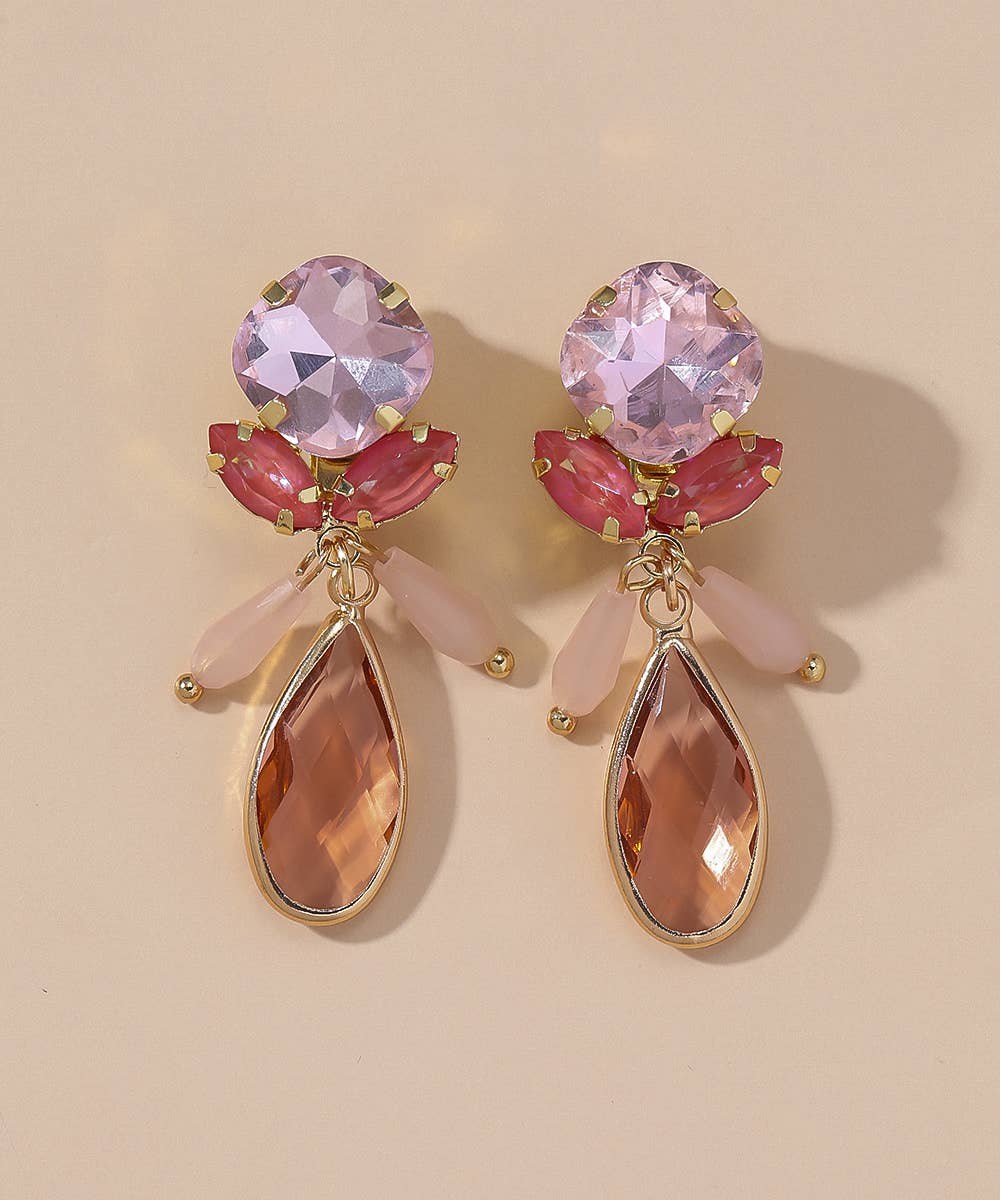BRINCO DE MOLA COM DETALHE DE FLOR ROSA