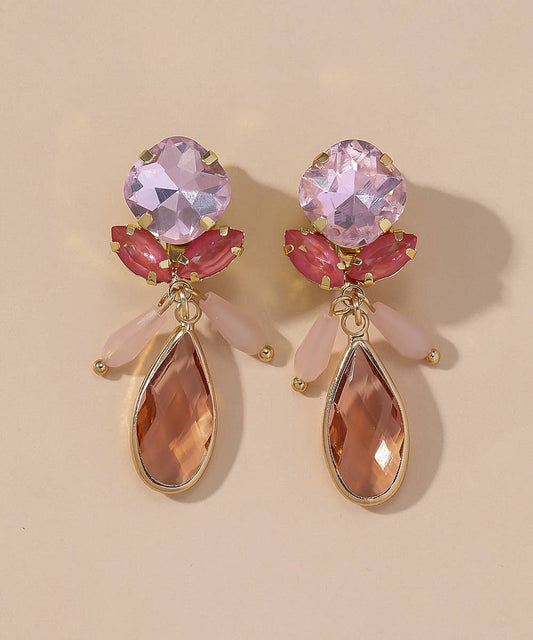 BRINCO DE MOLA COM DETALHE DE FLOR ROSA